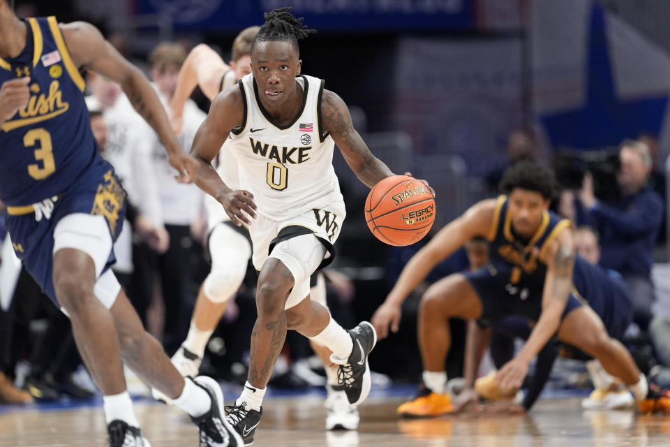 Wake Forest guard Kevin Miller (0) dribbles the ball during the first half of an NCAA college basketball game against Notre Dame in the second round of the Atlantic Coast Conference tournament, Wednesday, March 13, 2024, in Washington. (AP Photo/Susan Walsh)