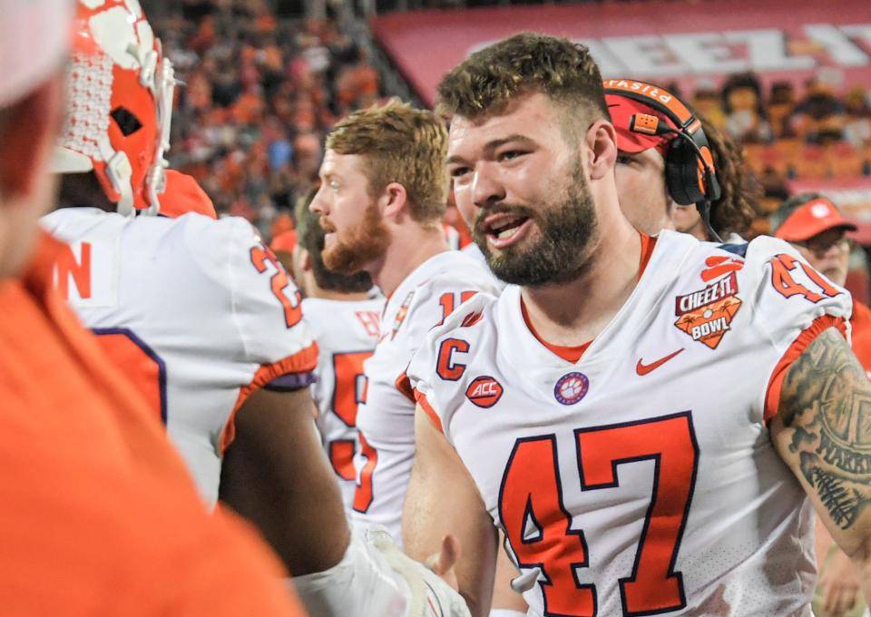 Clemson linebacker James Skalski(47) talks with linebacker Trenton Simpson (22) on the sideline during the third quarter of the 2021 Cheez-It Bowl at Camping World Stadium in Orlando, Florida Wednesday, December 29, 2021.