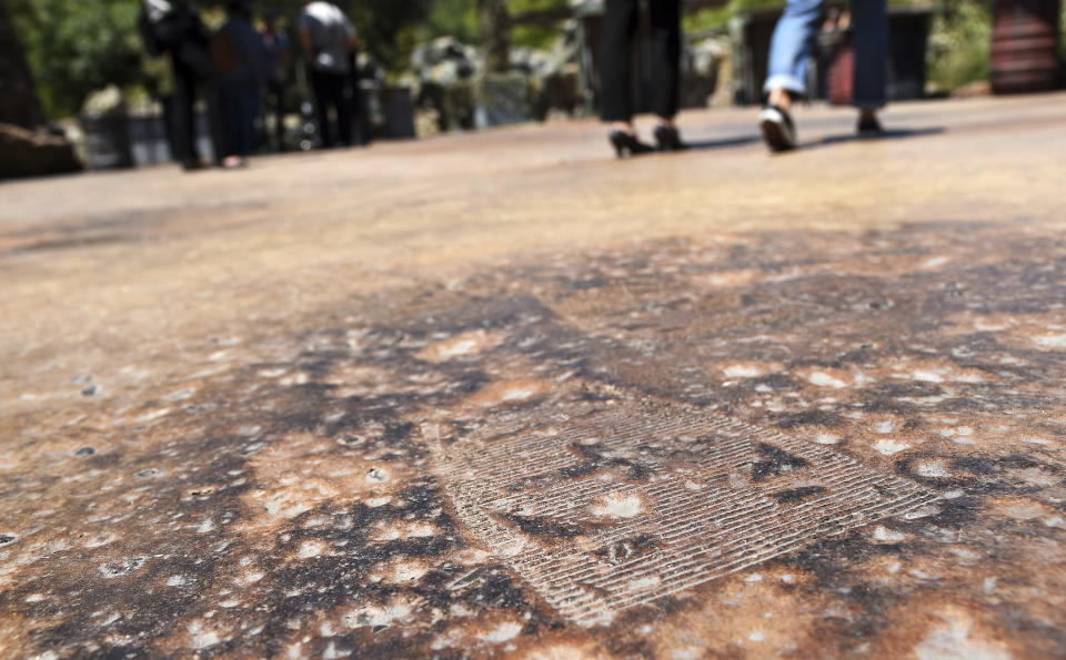 A GNK power droid footprint is pictured on a walking path during the Star Wars: Galaxy's Edge Media Preview at Disneyland Park, Wednesday, May 29, 2019, in Anaheim, Calif. (Photo by Chris Pizzello/Invision/AP)