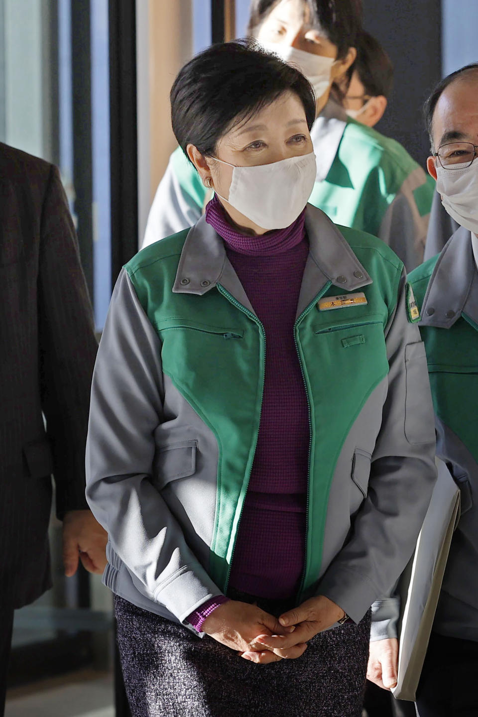 Tokyo Gov. Yuriko Koike prepares to meet Japan’s Economy Minister Yasutoshi Nishimura in Tokyo Saturday, Jan. 2, 2021. Japan’s capital of Tokyo and three nearby prefectures asked the national government Saturday to declare a “state of emergency” to curtail the surging spread of the coronavirus pandemic. (Jun Hirata/Kyodo News via AP)