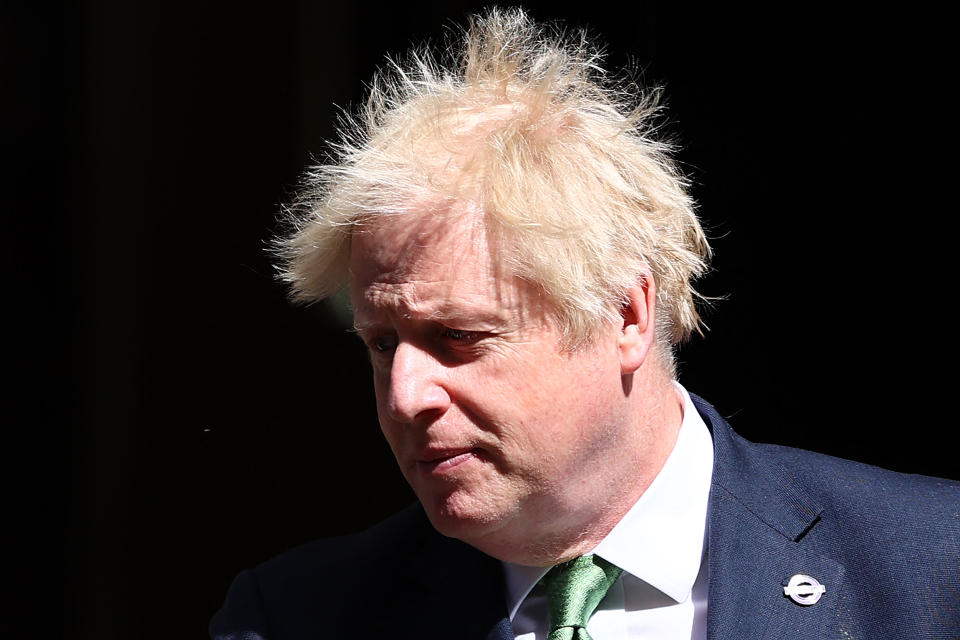 Britain's Prime Minister Boris Johnson leaves 10 Downing Street in London on May 18, 2022 to take part in the weekly session of Prime Minister's Questions (PMQs) at the House of Commons. (Photo by Adrian DENNIS / AFP) (Photo by ADRIAN DENNIS/AFP via Getty Images)