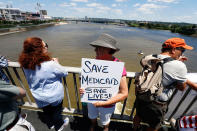 <p>People protest at a “Bridging the Gap For Healthcare Rally” on the Roebling Suspension Bridge July 9, 2017 in Covington, Ky. The rally was part of a day of healthcare-related protests in Covington, with another rally being held there tonight lead by Senator Bernie Sanders to urge Senate Majority Leader Sen. Mitch McConnell not to repeal the Affordable Care Act. (Photo: Bill Pugliano/Getty Images) </p>