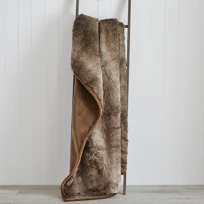Have a thick faux fur throw on hand for wintry evenings