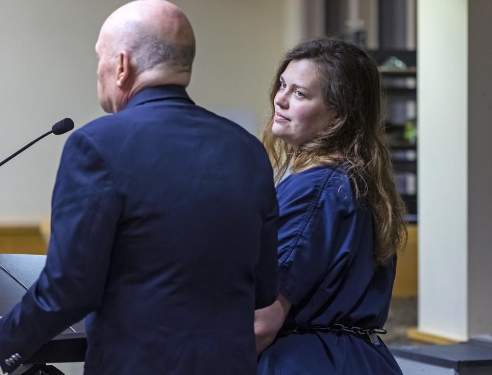 Hannah Roemhild, right, who is accused of driving through checkpoints outside President Donald Trump's Florida home Mar-a-Lago, listens during her initial appearance hearing, Monday, Feb. 3, 2020, West Palm Beach, Fla. (Lannis Waters/The Palm Beach Post via AP)