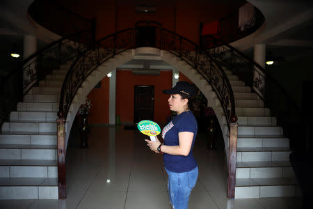 Emily Hernandez stands in her house in Intipuca, El Salvador, August 14, 2018. REUTERS/Jose Cabezas