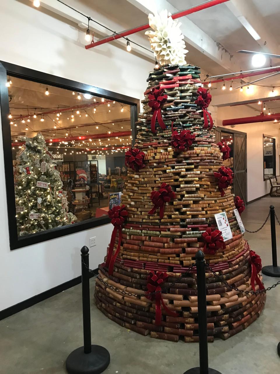 A book tree was erected at The Factory at Columbia, comprised of antique books. A $1,000 prize will be given to the person who can most accurately guess the number of books that make up the tree.