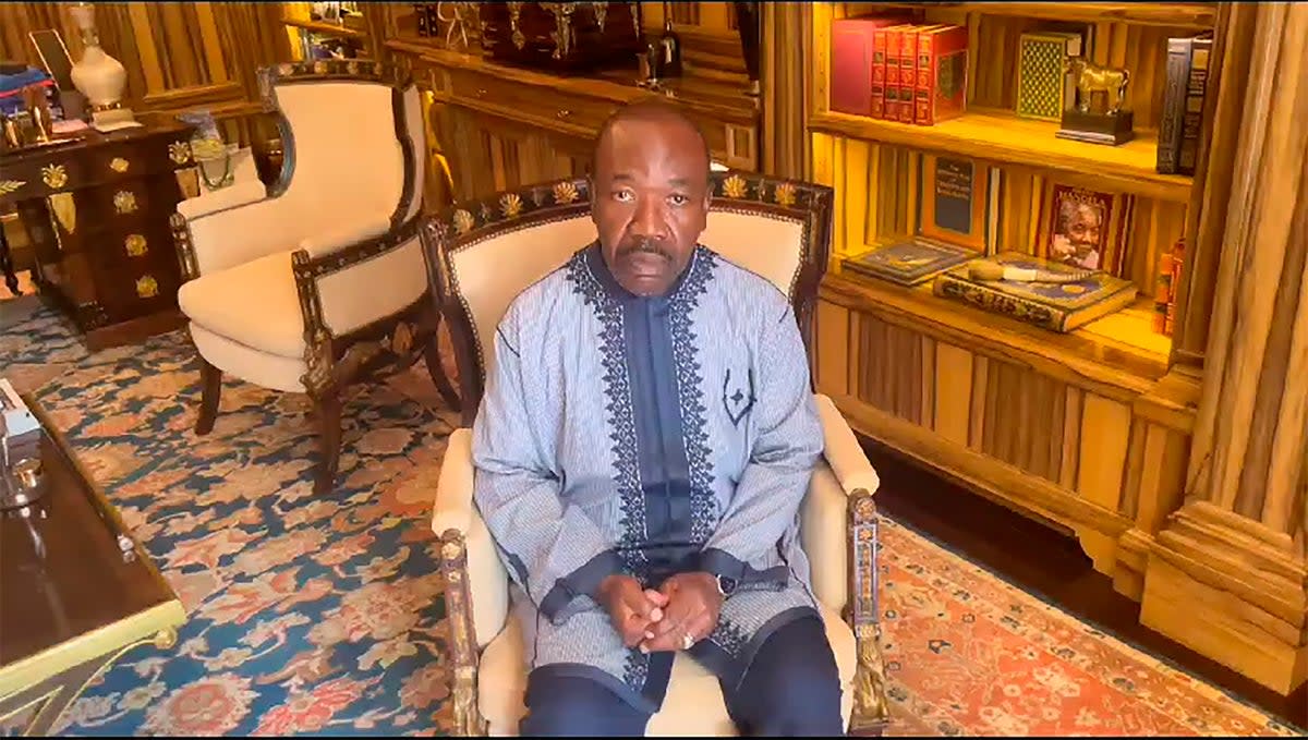 Gabon president Ali Bongo Ondimba records a video from his residence in Libreville, calling on supporters to make ‘noise’ (AP)