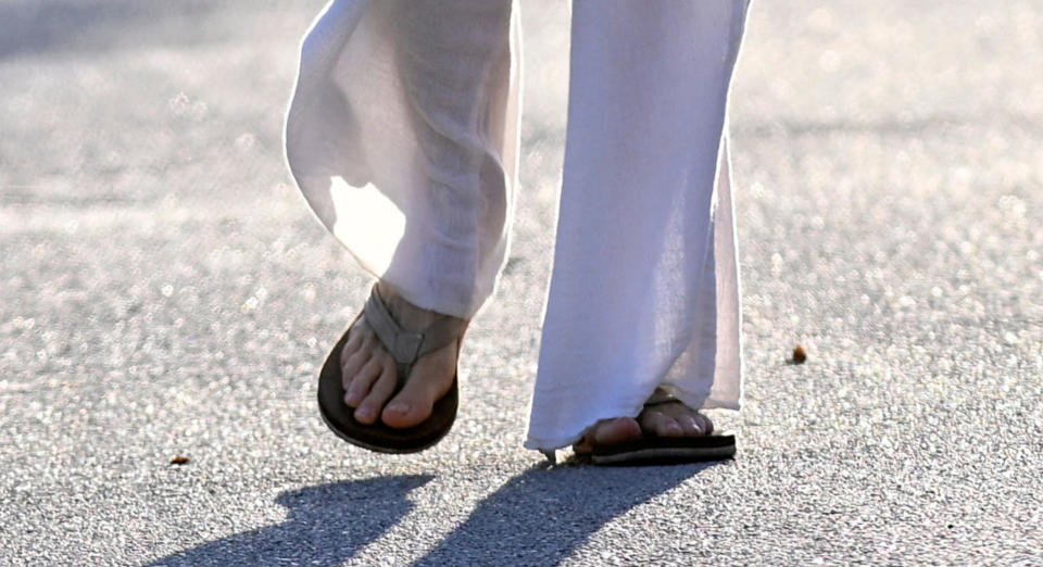 Gisele Bündchen wearing flip-flops.