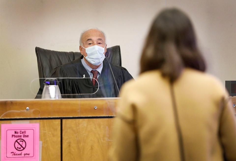 Judge Mark Coven listens to a prosecutor before jury selection begins in the trial of former Cohasset teacher Jeffrey Knight in Quincy District Court on Monday, Nov. 15, 2021.