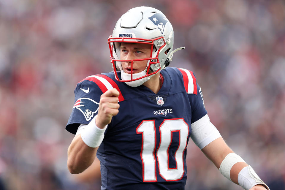 FOXBOROUGH, MASSACHUSETTS - NOVEMBER 14: Mac Jones #10 of the New England Patriots celebrates the touchdown by Rhamondre Stevenson #38 against the Cleveland Browns during the third quarter at Gillette Stadium on November 14, 2021 in Foxborough, Massachusetts. (Photo by Maddie Meyer/Getty Images)