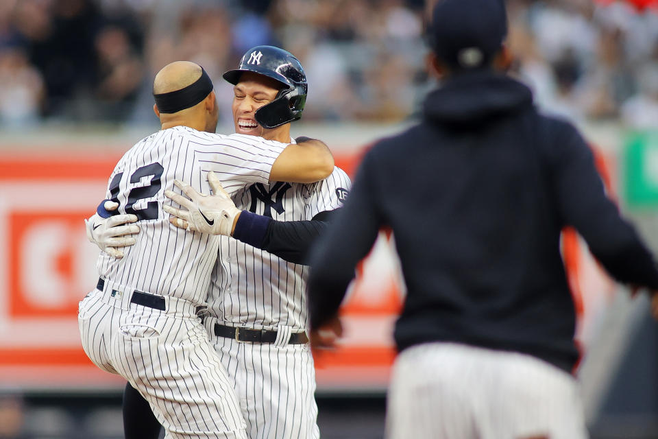 NEW YORK, NEW YORK - OCTOBER 03: Aaron Judge #99 of the New York Yankees celebrates with Rougned Odor #12 after hitting a walk-off single in the bottom of the ninth inning to beat the Tampa Bay Rays 1-0 at Yankee Stadium on October 03, 2021 in New York City. (Photo by Mike Stobe/Getty Images)