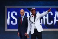 <p>NEW YORK, NY – JUNE 23: Buddy Hield, right, gestures to the crowd while standing next to NBA Commissioner Adam Silver after Hield was drafted sixth overall by the New Orleans Pelicans in the first round of the 2016 NBA Draft at the Barclays Center on June 23, 2016 in the Brooklyn borough of New York City. (Photo by Mike Stobe/Getty Images) </p>