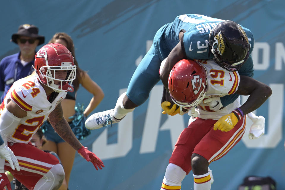 Kansas City Chiefs wide receiver Kadarius Toney (19) is hit by Jacksonville Jaguars cornerback Darious Williams (31) after a catch during the second half of an NFL football game, Sunday, Sept. 17, 2023, in Jacksonville, Fla. (AP Photo/Phelan M. Ebenhack)