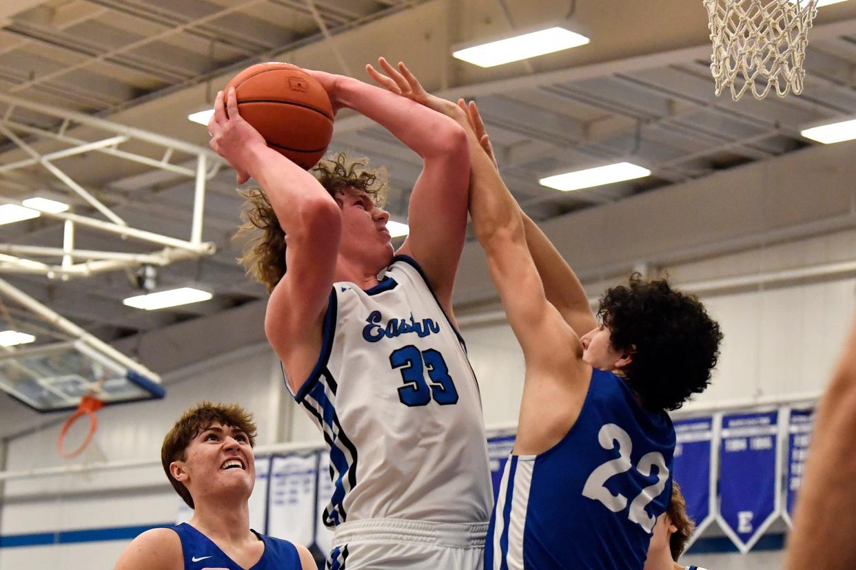 Eastern's Sam Bird shoots over Oldham County's Luis Nava during the second half. Nava had five blocks in the Colonels' 70-62 victory Friday night in the title game of the 2023 Middletown Holiday Classic.