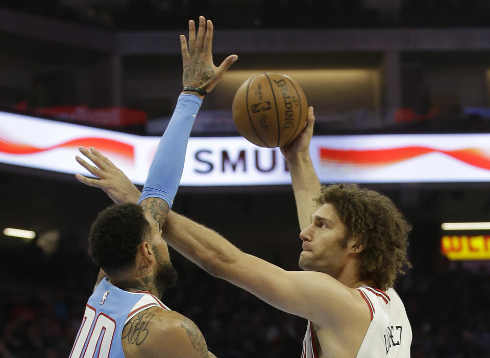 Chicago Bulls center Robin Lopez, right, shoots over Sacramento Kings center Willie Cauley-Stein during the first quarter of an NBA basketball game Monday, Feb. 5, 2018, in Sacramento, Calif. (AP Photo/Rich Pedroncelli)