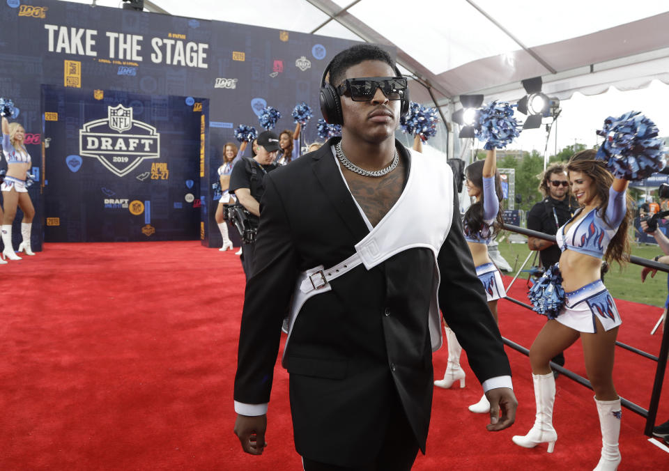 Michigan linebacker Devin Bush walks the red carpet ahead of the first round at the NFL football draft, Thursday, April 25, 2019, in Nashville, Tenn. (AP Photo/Steve Helber)