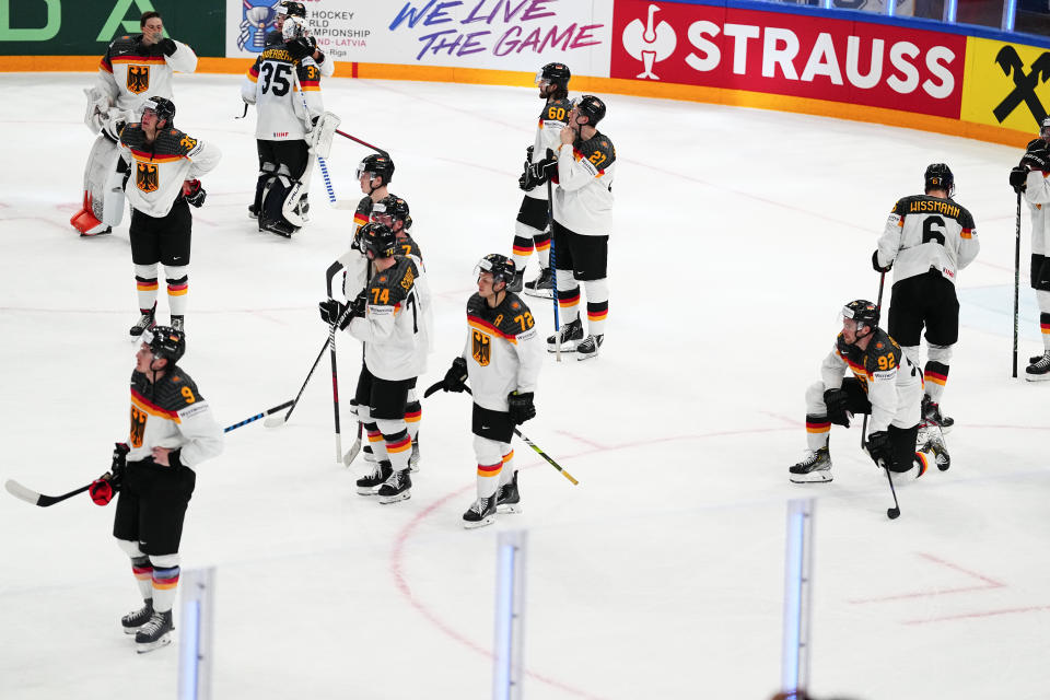 Germany reacts after its loss to Canada during the gold medal match at the Ice Hockey World Championship in Tampere, Finland, Sunday, May 28, 2023. Canada won 5-2. (AP Photo/Pavel Golovkin)