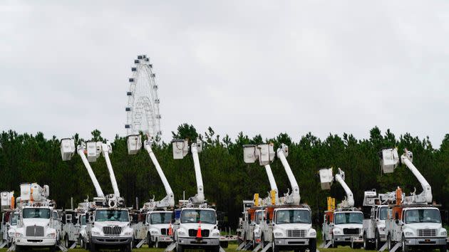 Utility trucks are staged near the Orange County Convention Center ahead of Hurricane Ian on Wednesday in Orlando. (Photo: John Raoux/AP)