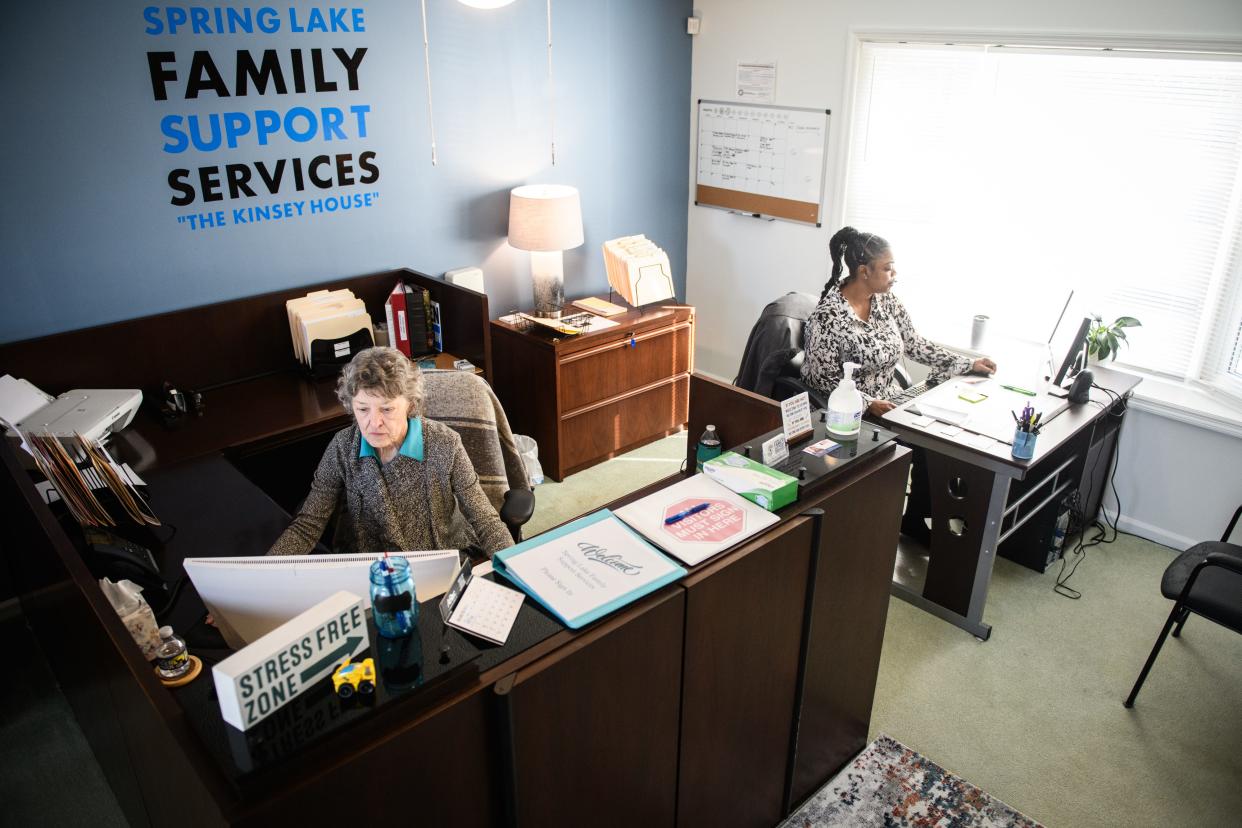 Sandy Woltmann, left, and Ernena Phillips at work at Spring Lake Family Support Services, which helps residents connect with services and get the aid they require.