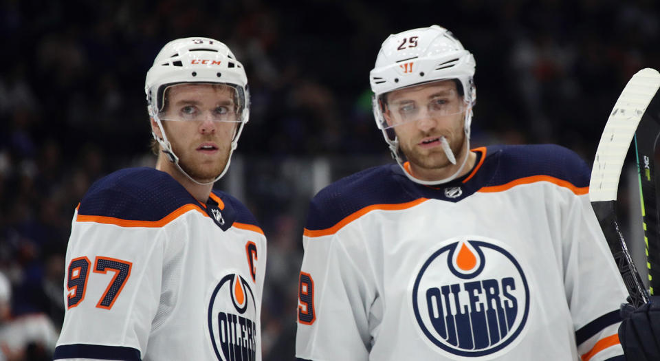 NEW YORK, NEW YORK - OCTOBER 08: Connor McDavid #97 and Leon Draisaitl #29 of the Edmonton Oilers prepare to skate against the New York Islanders  at NYCB's LIVE Nassau Coliseum on October 08, 2019 in Uniondale, New York. (Photo by Bruce Bennett/Getty Images)