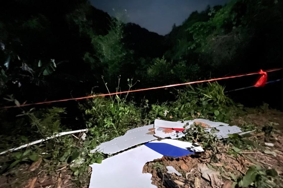 Debris at the site of a plane crash in Tengxian County, southern China (Xinhua)