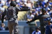 Mar 28, 2019; Los Angeles, CA, USA; Arizona Diamondbacks right fielder Adam Jones (10) celebrates while crossing home after hitting a solo home run during the sixth inning against the Los Angeles Dodgers at Dodger Stadium. Mandatory Credit: Kelvin Kuo-USA TODAY Sports