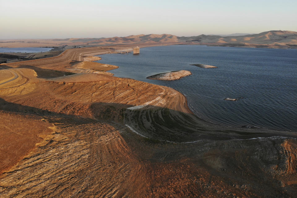 FILE - Water levels are low at San Luis Reservoir, which stores irrigation water for San Joaquin Valley farms, in Gustine, Calif., Sept. 14, 2022. California has experienced a devastating, multi-year drought that’s depleted reservoirs, forced officials to plead with residents to conserve water and constrained supplies to vital farmland. (AP Photo/Terry Chea, File)