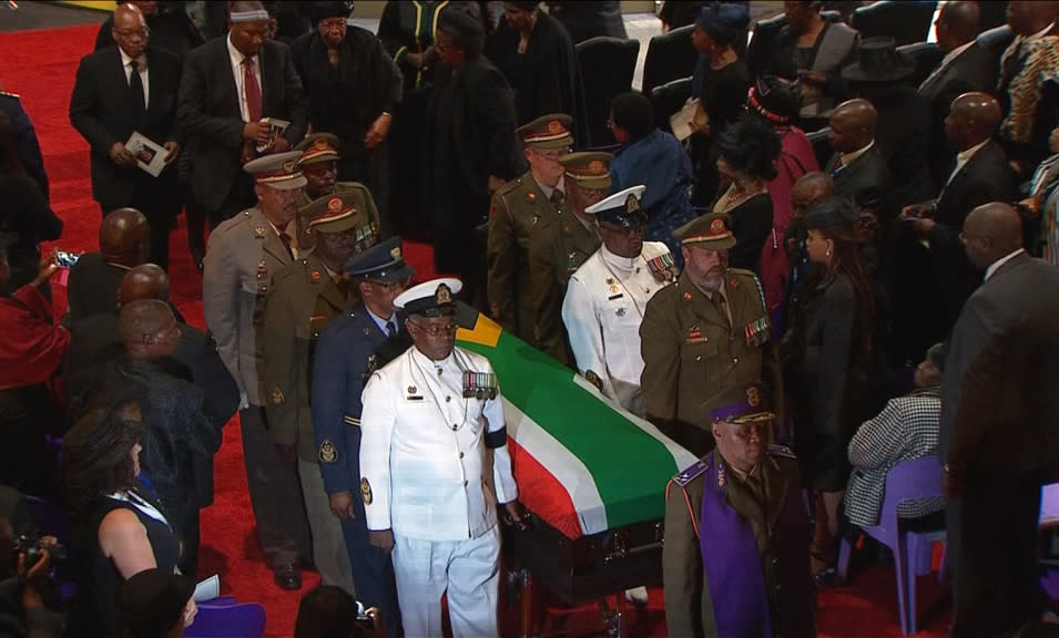 The coffin of former South African President Mandela is carried by military personnel at end of funeral service in his ancestral village of Qunu