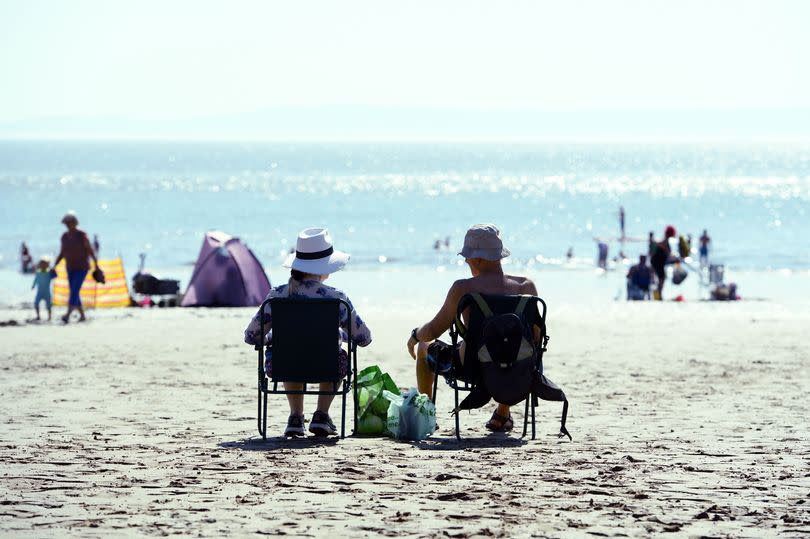 People sat on a beach