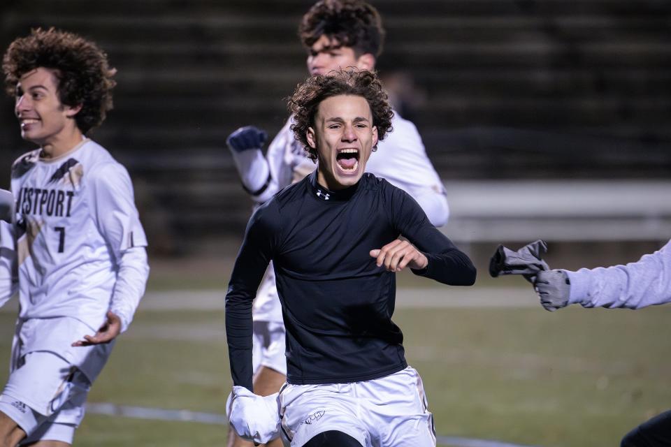 Westport's Nyzaiah Pacheco celebrates after scoring the winning goal in penalty kicks to defeat Douglas in the Division 5 state soccer final.