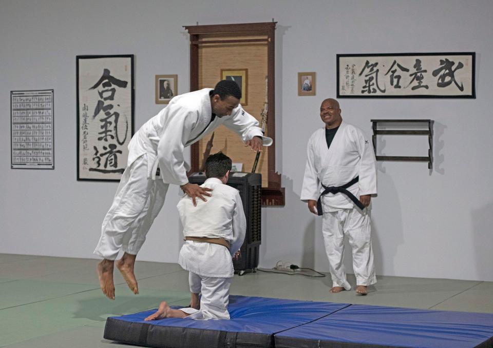 Sensei Earl Wright watches over his students as they practice their technique during a workout at the Ellyson Industrial Park DoJo on Friday, June 10, 2022. 