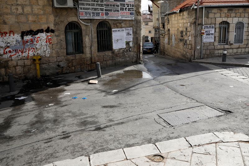 A street corner in Jerusalem's Mea Shearim neighbourhood where Ultra-Orthodox Jewish men burn leaven ahead of the Jewish holiday of Passover, seen deserted amid the coronavirus (COVID-19) restrictions in Jerusalem