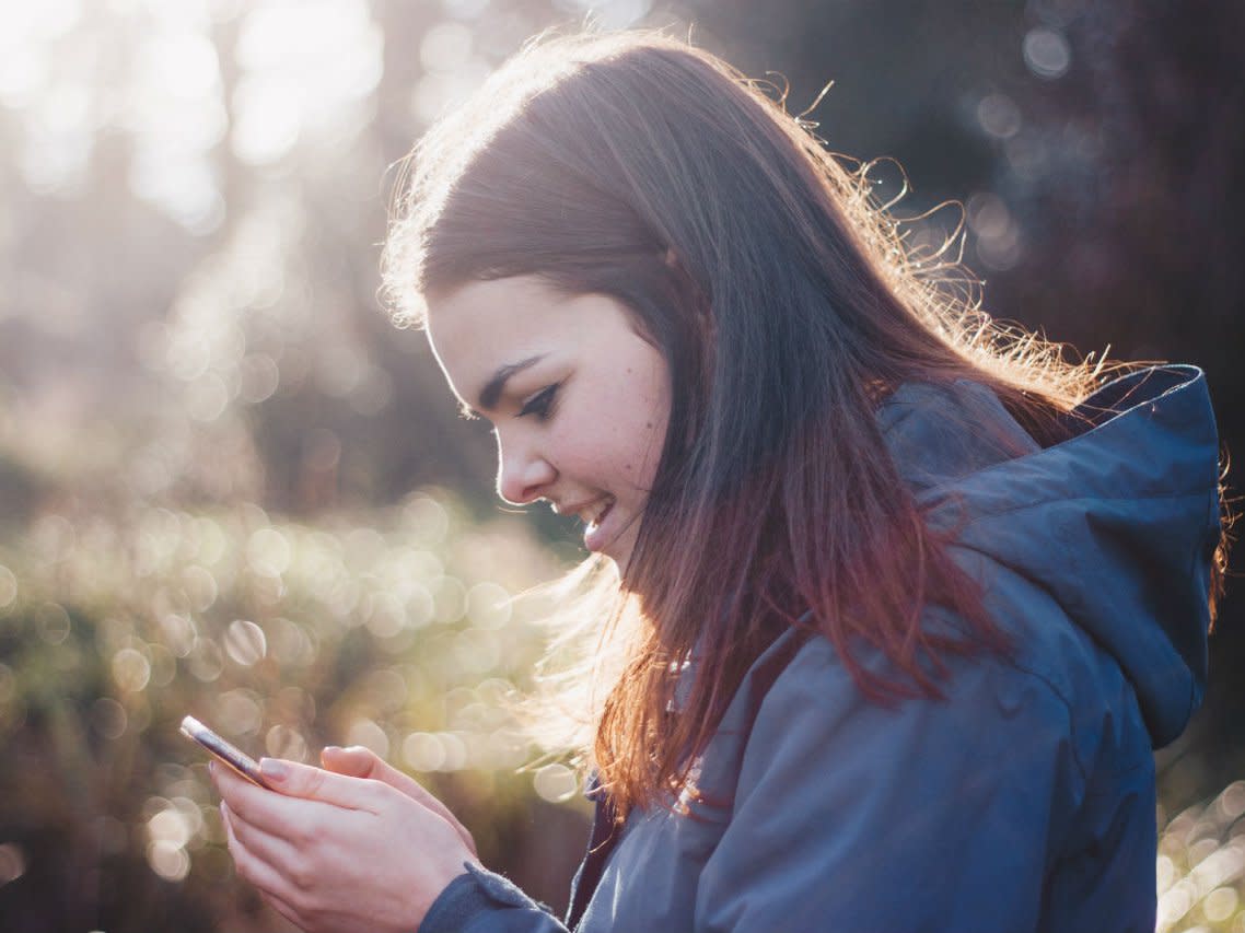 woman sending text