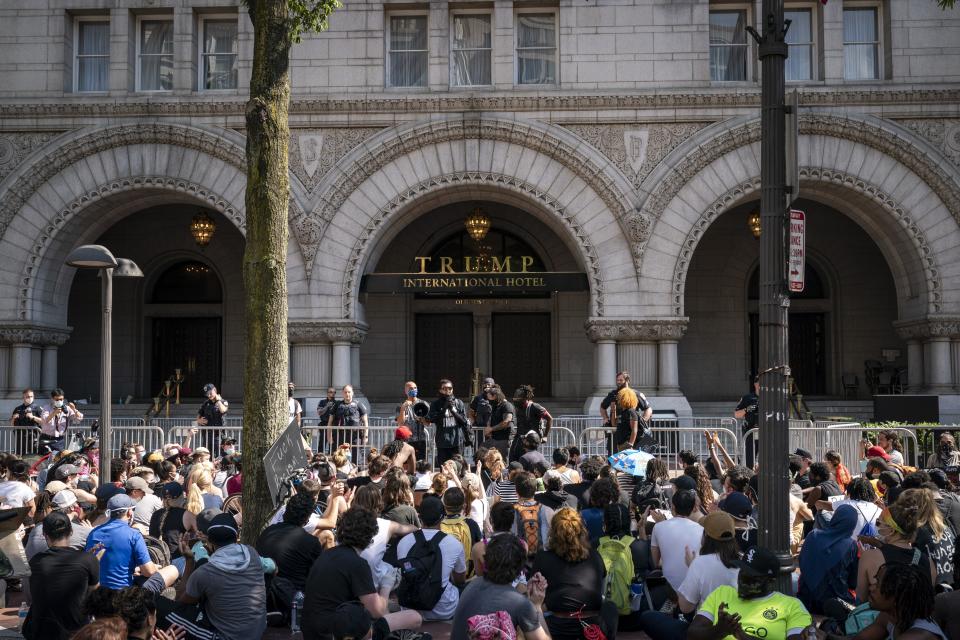 Demonstrators peacefully protest outside  Trump International Hotel in Washington on June 3.