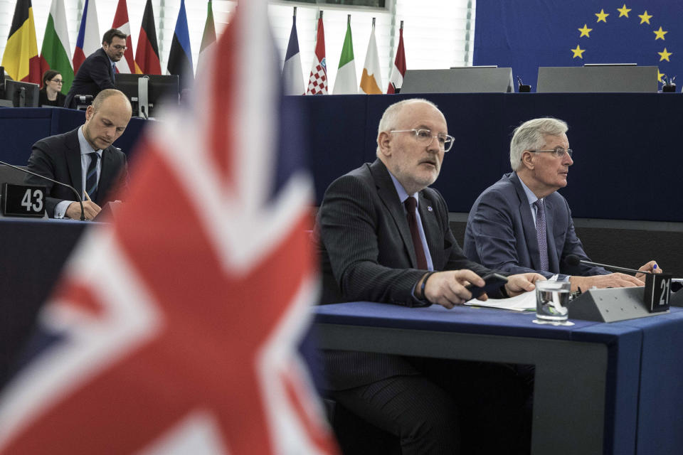 European Union's Frans Timmermans, first vice president of the Commission, center left, and European Union's chief Brexit negotiator Michel Barnier, right, attend a session at the European Parliament in Strasbourg, eastern France, Wednesday, March 13, 2019. British lawmakers rejected May's Brexit deal in a 391-242 vote on Tuesday night. Parliament will vote Wednesday on whether to leave the EU without a deal. (AP Photo/Jean Francois Badias)