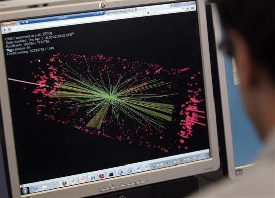 A technician looks at collision at the CMS experiment in the control room of the Large Hadron Collider (LHC) at the European Organization for Nuclear Research (CERN) near Geneva, Switzerland April 5, 2012. At 0:38 CEST this morning, the LHC shift crew declared "stable beams" as two 4 TeV proton beams were brought into collision at the LHC's four interaction points. The collision energy of 8 TeV is a new world record, and increases the machine's discovery potential considerably.