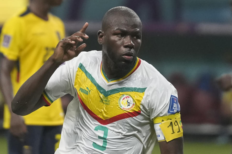 Senegal's Kalidou Koulibaly celebrates after scoring his side's second goal during the World Cup group A soccer match between Ecuador and Senegal, at the Khalifa International Stadium in Doha, Qatar, Tuesday, Nov. 29, 2022. (AP Photo/Darko Vojinovic)