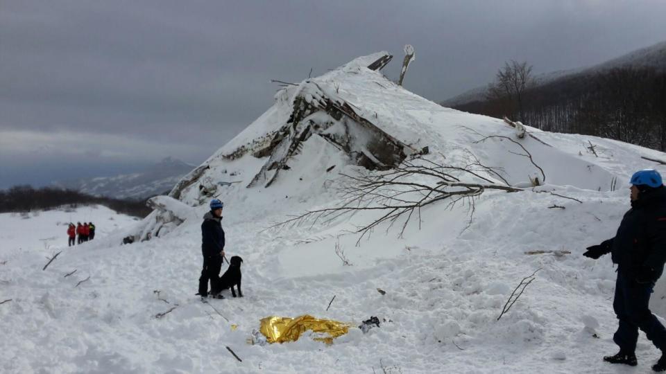 Italian Mountain Rescue Corps "Corpo Nazionale Soccorso Alpino e Speleologico" Soccorso Alpino volunteers and rescuers work in the area of the avalanche-struck Hotel Rigopiano, near in Farindola, central Italy, Sunday, Jan. 22, 2017. (Corpo Nazionale Soccorso Alpino e Speleologico/ANSA via AP)