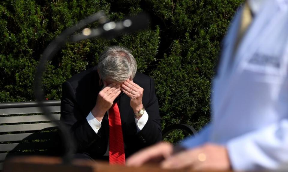 Meadows rubs his head as doctors speak about Trump’s health in Bethesda on 4 October.