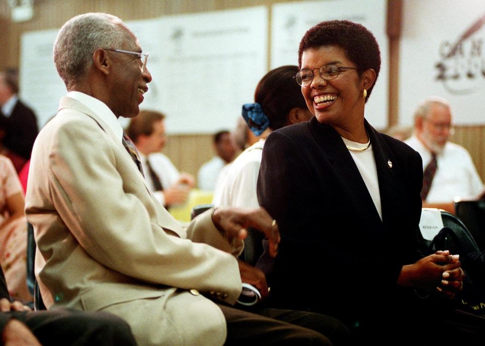 Columbus Schools superintendent candidate Rosa Smith, right, chats with Rev. Leon Troy Sr. before a public forum at the Board of Education Building at 270 E. State St. in this July 8, 1997 Dispatch file photo.
