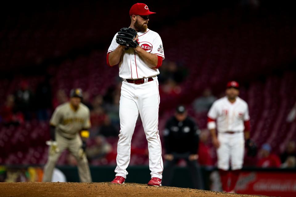 Cincinnati Reds relief pitcher Buck Farmer (46) prepares to pitch in the ninth inning of the MLB baseball game between Cincinnati Reds and San Diego Padres at Great American Ball Park in Cincinnati on Tuesday, April 26, 2022. San Diego Padres defeated Cincinnati Reds 9-6.