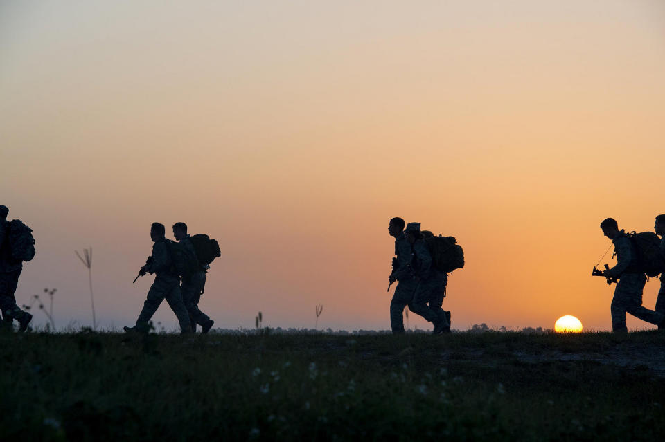 Airmen from the 93rd Air Ground Operations Wing run the final stretch of a 4-mile ruck march during Spartan Warrior May 12, 2015, at Avon Park Air Force Range, Florida. Spartan Warrior is an annual wing combat readiness inspection and competition held by the 93rd AGOW.