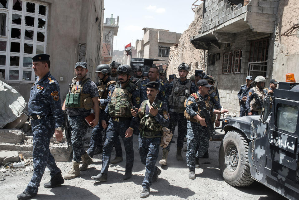 <p>Iraqi Federal Police command and soldiers on the frontline against Islamic State in Adedat, a neighbourhood in the Old City of west Mosul, the last area of the city under Islamic State control, June 22, 2017. (Photo: Martyn Aim/Getty Images) </p>