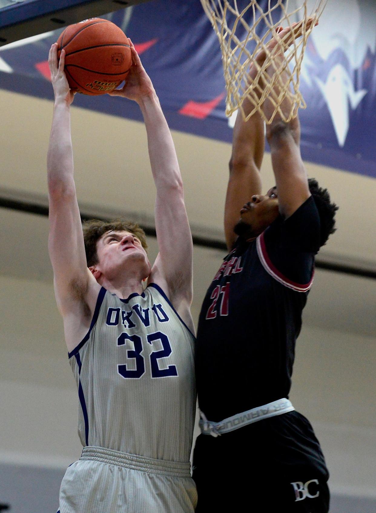 Blake Hamblin, left, makes a strong move inside for Oklahoma Wesleyan University during a men's basketball home game on Jan. 26, 2023.