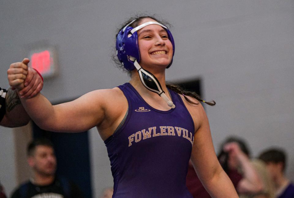 Fowlerville's Hannah Blyveis is all smiles after defeating Symiah Stone from Eaton Rapids in the 130 weight class in the CAAC Wrestling Championships Saturday, Feb. 3, 2024.