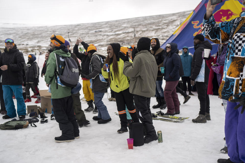 Participants in the Winter Win Slopestyle snowboard and ski competition at the Afriski ski resort near Butha-Buthe, Lesotho, wait for the results, Saturday July 30, 2022. While millions across Europe sweat through a summer of record-breaking heat, Afriski in the Maluti Mountains is Africa's only operating ski resort south of the equator. It draws people from neighboring South Africa and further afield by offering a unique experience to go skiing in southern Africa. (AP Photo/Jerome Delay)