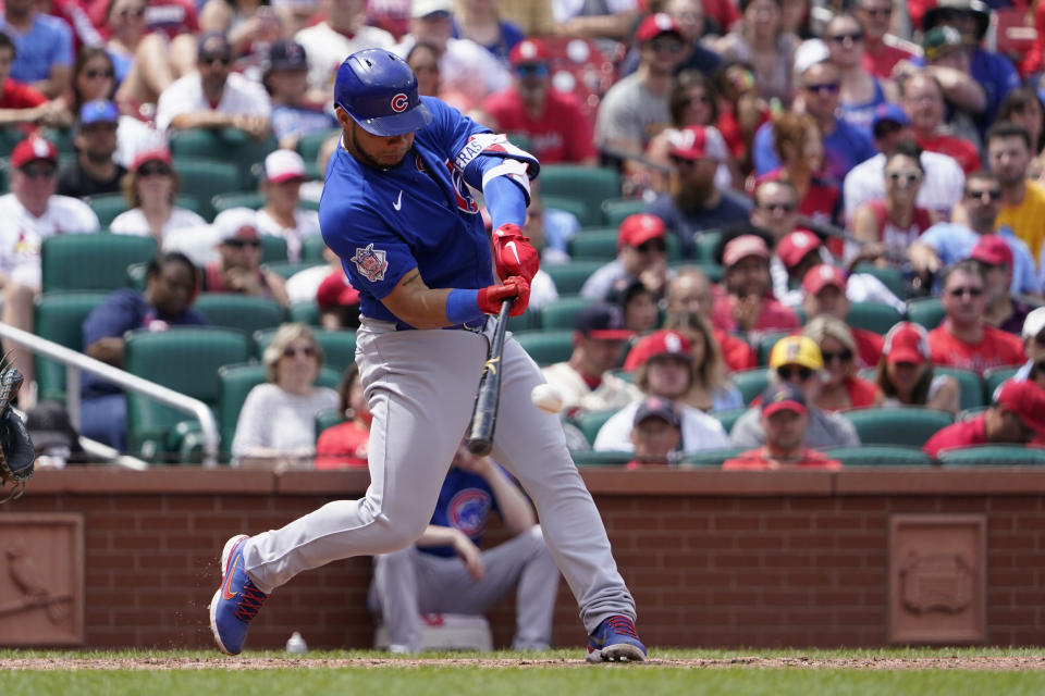 Chicago Cubs' Willson Contreras hits a two-run single during the fourth inning of a baseball game against the St. Louis Cardinals Sunday, June 26, 2022, in St. Louis. (AP Photo/Jeff Roberson)