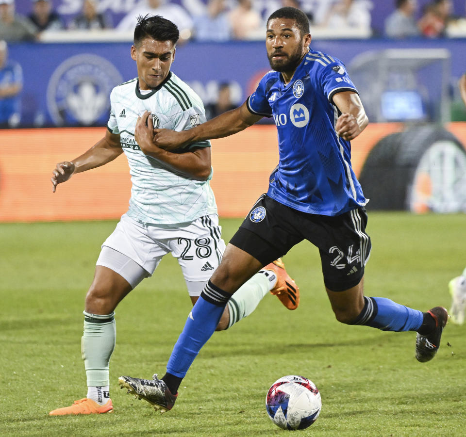 CF Montreal's George Campbell, right, holds off a challenge by Atlanta United's Tyler Wolff during the second half of an MLS soccer match Saturday, July 8, 2023, in Montreal. (Graham Hughes/The Canadian Press via AP)