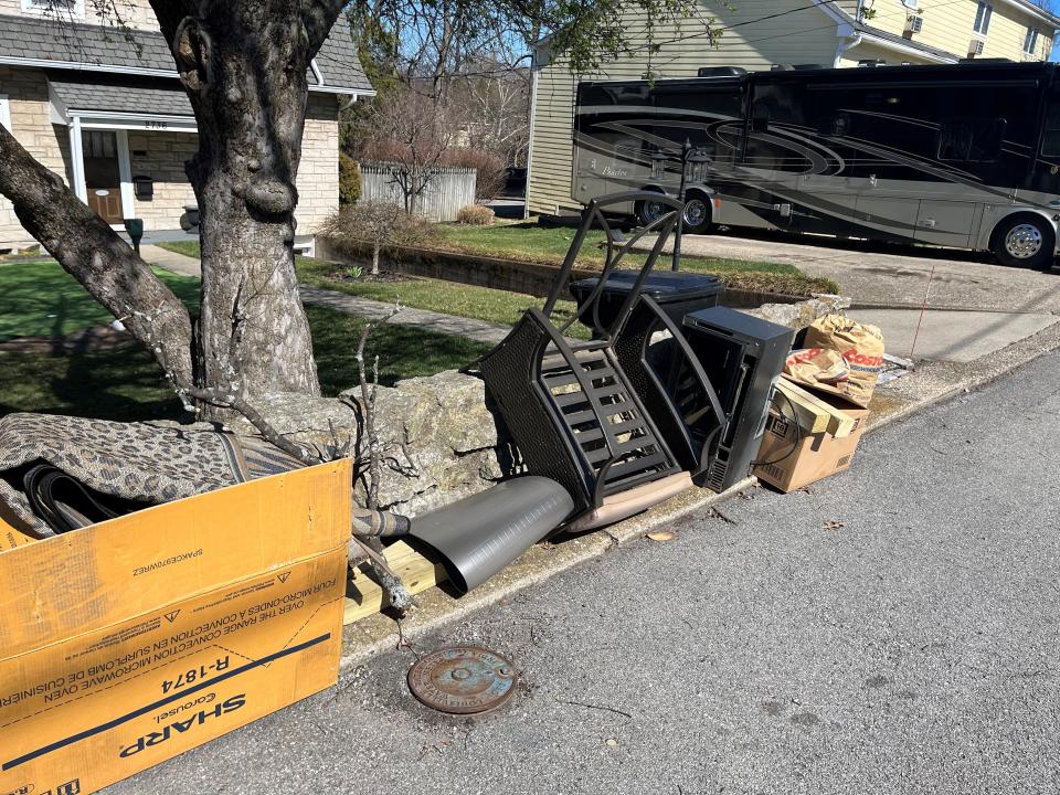 Chris Joyce, of Crescent Hill, set out an old microwave oven, outdoor chair and other things for junk pickup. He expected someone to take the microwave before city workers haul it away.
