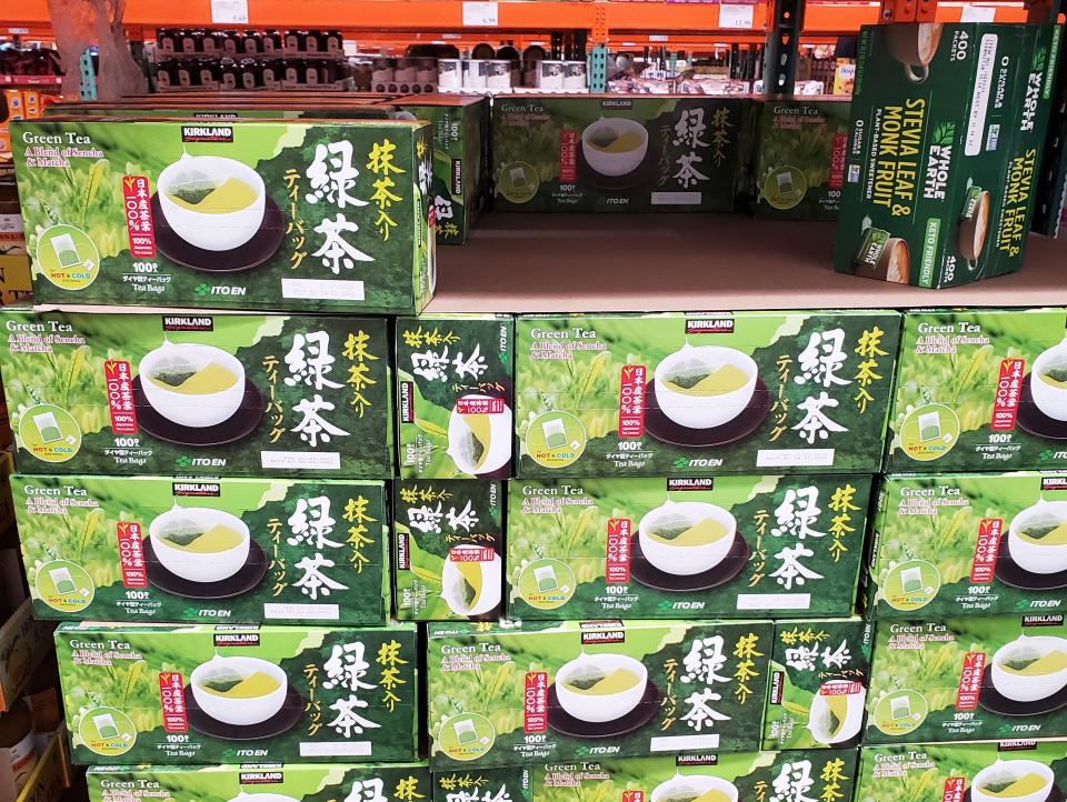 green stacked boxes of Green tea at Costco